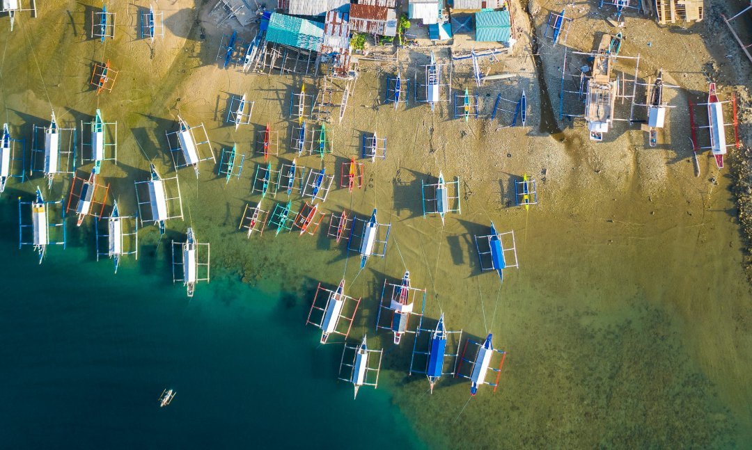 Beach with many boats and houses