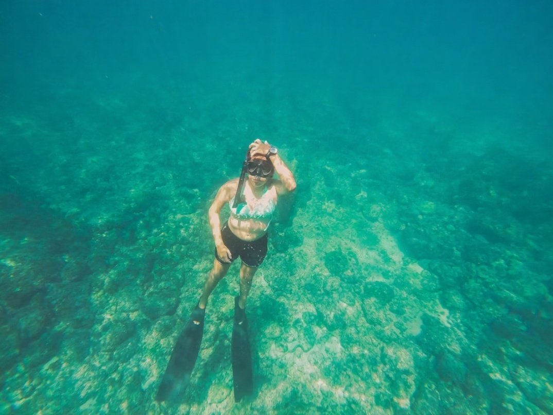 Woman snurkling underwater
