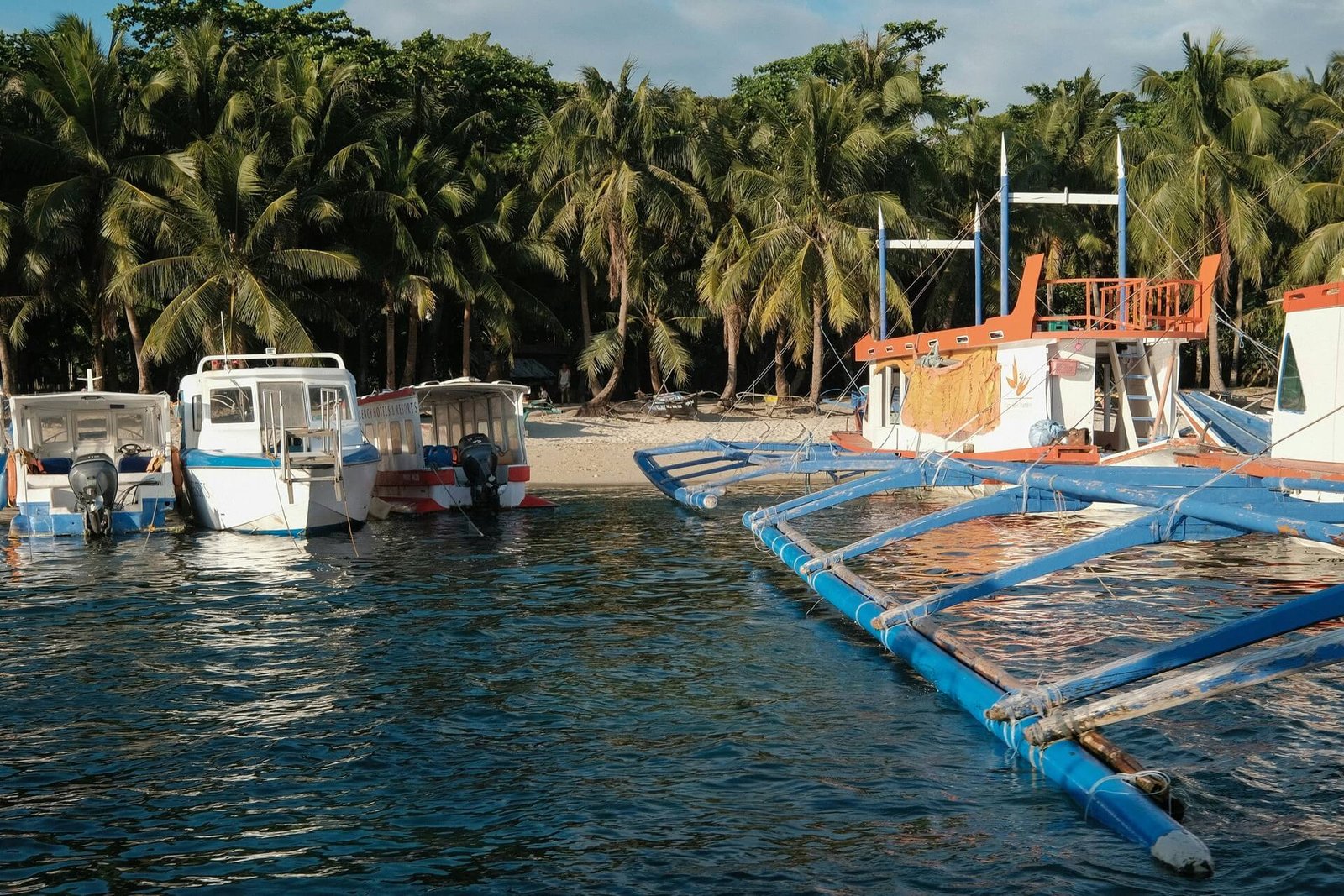 Outrigger boats lined up for passenger transport in Boracay