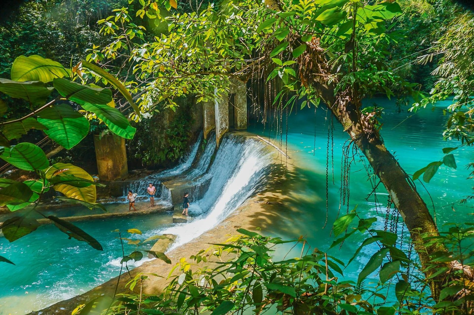 Turquoise stream spilling over a weir in the jungle of Badian, Cebu