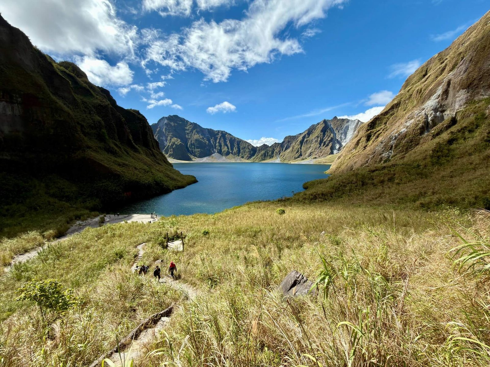 Grassy trail above the blue crater lake of Mt Pinatubo, Botolan, Zambales